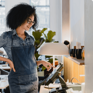 Woman next to a cash register